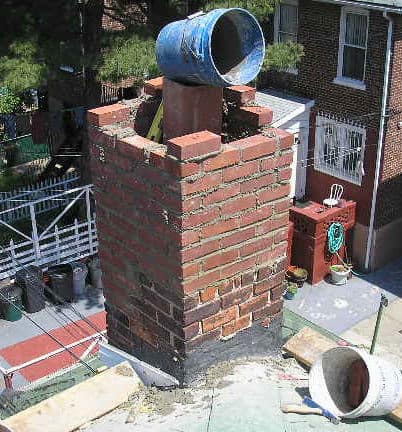 Chimney Worker On Roof