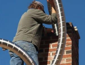 Man working with chimney liner